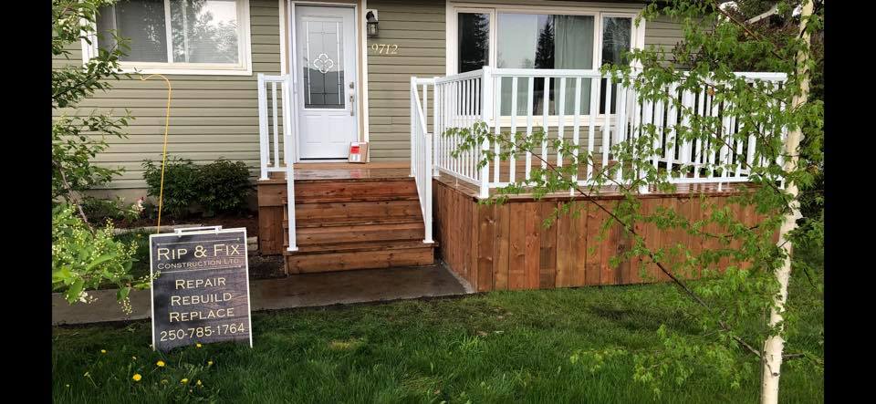 Alternate view displaying beautiful wooden staircase and railing .