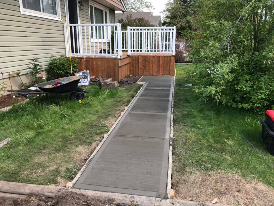 Wide view of new sidewalk leading to the front proch.