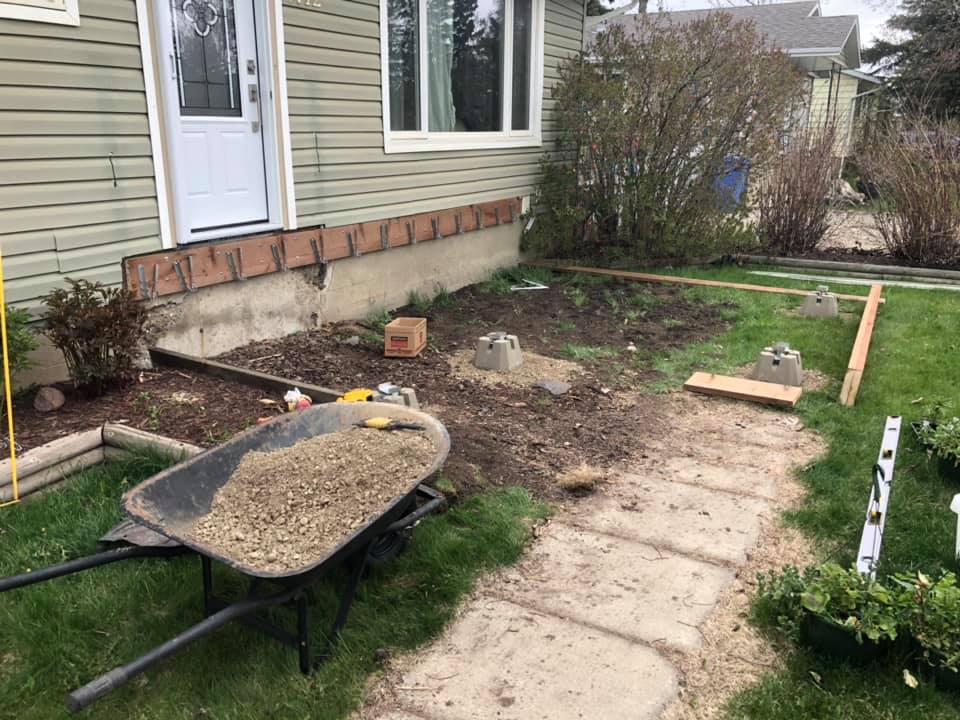 Photo of beginning of project building a firm foundation for the front porch.