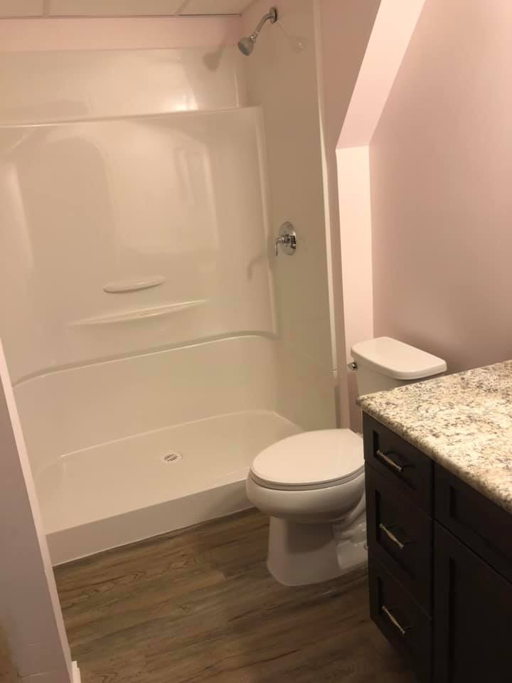 Alternate view of the finished bathroom showing the shower space.