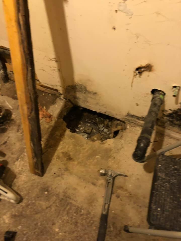 Photo showing damage to the floor had to be repaired.